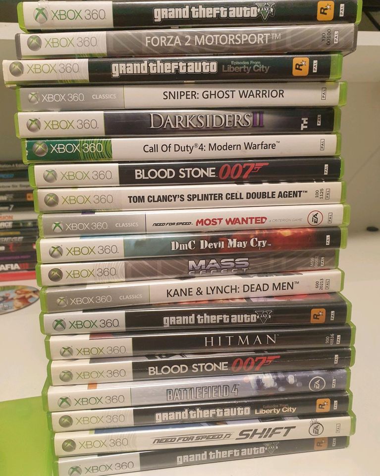Xbox 360 mit Spielen und Lenkrad in Neuwied