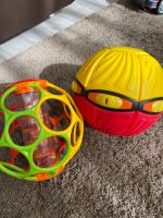 Oball Regenmacher Rassel+Frisbee Ball geschenkt Berlin - Marzahn Vorschau