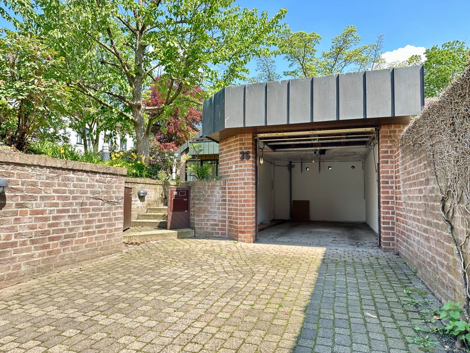 Moderne Eleganz und Grünoase mitten in Kleve:  Einfamilienhaus mit großzügiger Fensterfront und traumhaften Garten in Kleve