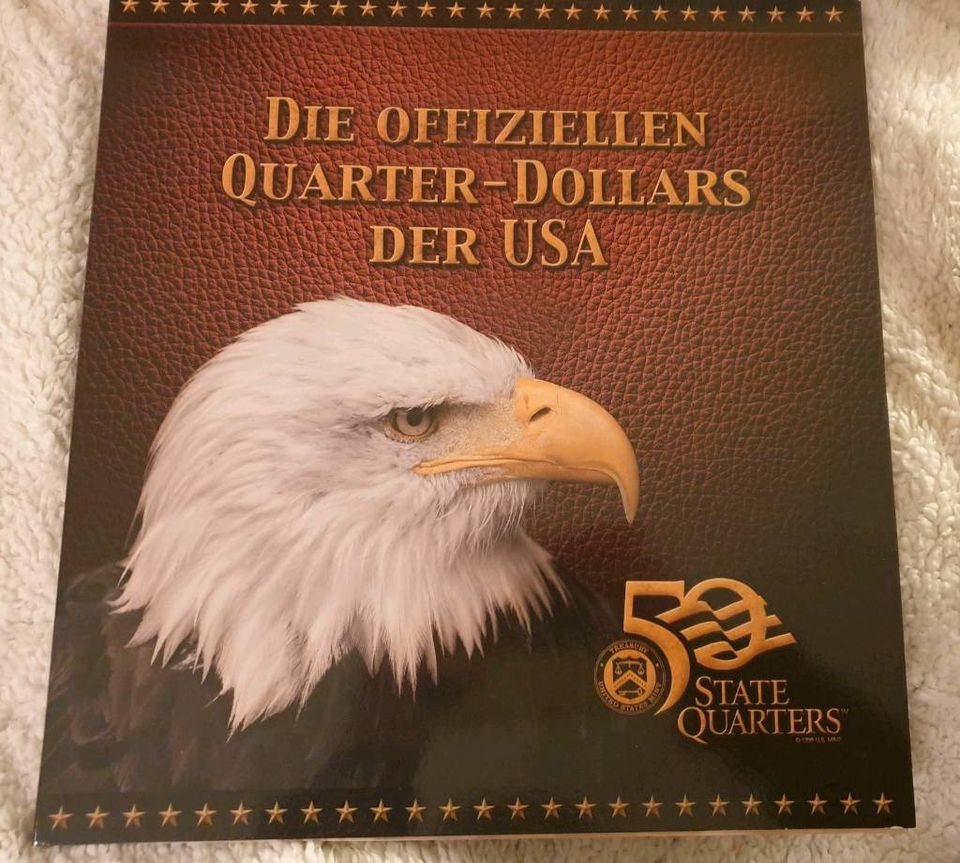 50 vergoldete Quarterdollars 1999-2009 in Köln