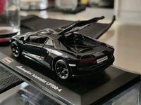 Bburago Lamborghini Modell Aventador LP700-4 1:32 schwarz Case Baden-Württemberg - Rauenberg Vorschau