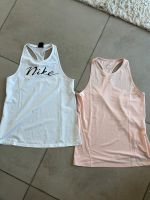 Sport-Tops von Nike, Gr. M, Weiß und Rose Baden-Württemberg - Engelsbrand Vorschau