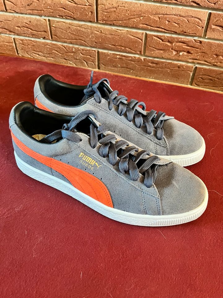 Puma Sneaker grau-orange Leder in Brachttal