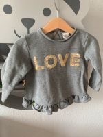 H&M Pullover Shirt grau EUR 80 Love Pailetten Brandenburg - Geltow Vorschau