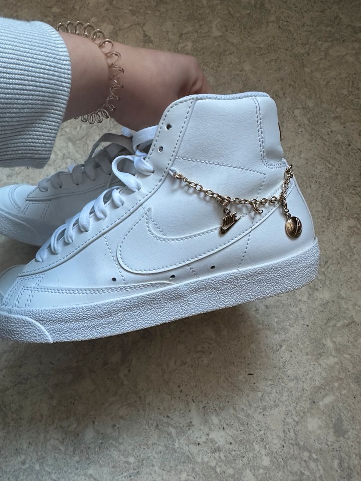 White nike with lucky charm in Hamburg