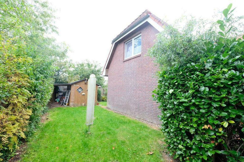 DAMLOS - Zweifamilienhaus in ruhiger Lage mit eigenem Garten und Doppelcarport in Lensahn