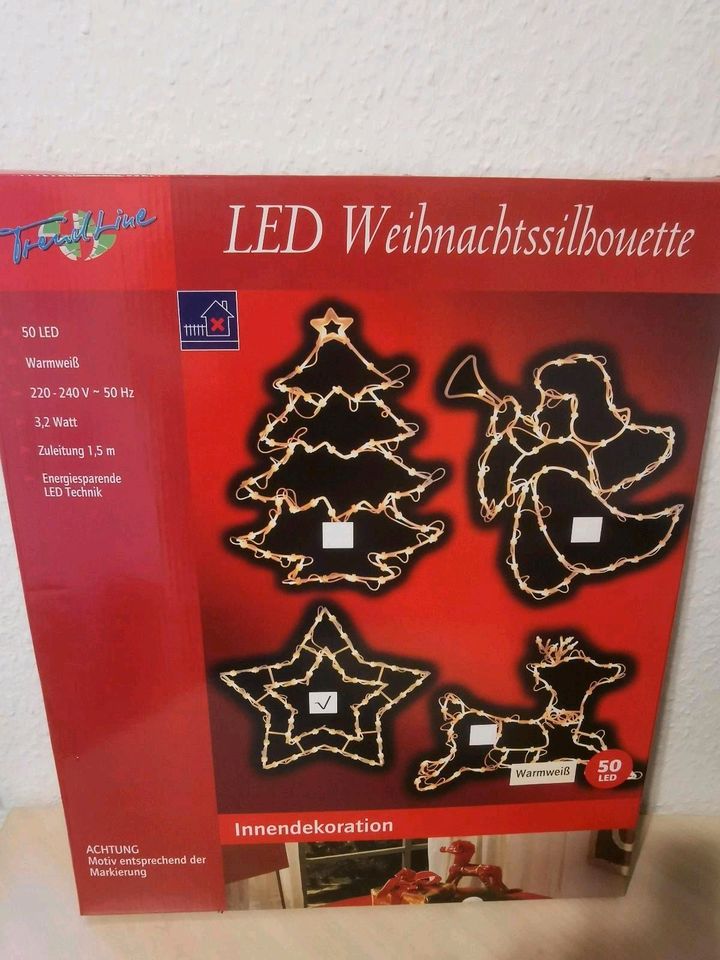 Weihnachtsbeleuchtung LED Silhouette in Kläden