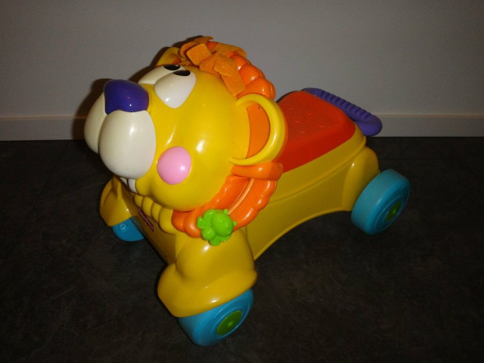 Fisher-Price Löwe 2 in 1, Rutschfahrzeug, Lauflernhilfe mit Musik in Coesfeld