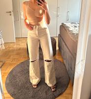 Beige wide leg Jeans mit Rissen an den Knien Düsseldorf - Benrath Vorschau