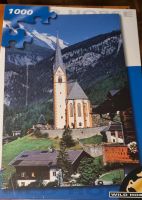 Puzzle 1000 Teile. Motiv Bergwelt mit Dorfkirche. Wuppertal - Cronenberg Vorschau