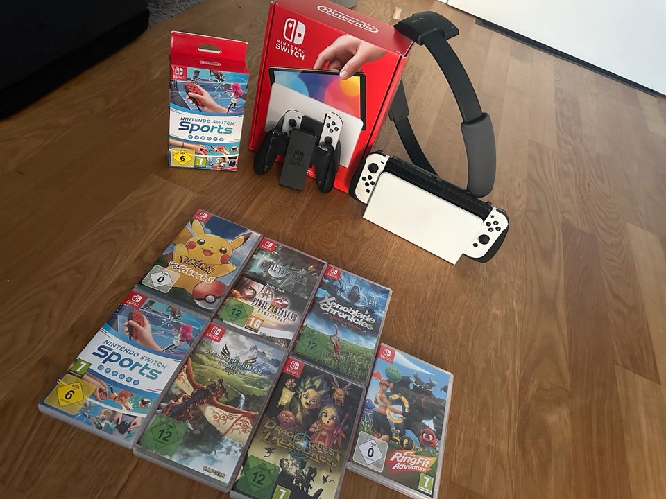 Nintendo Switch OLED mit Spielen in Kist