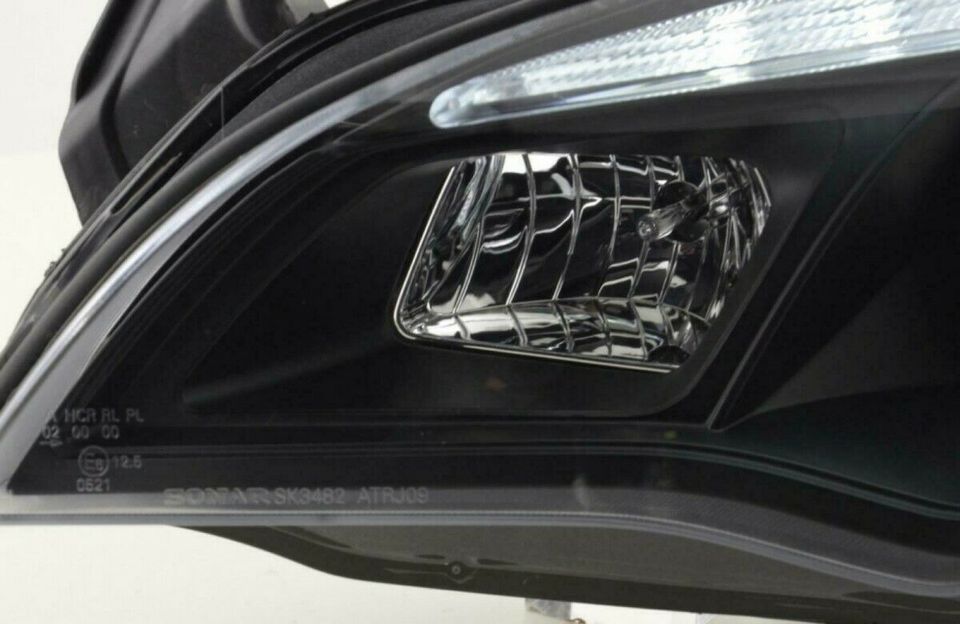 Led TFL Scheinwerfer Set schwarz für Opel Astra J BJ 2009 - 2012 in Calden