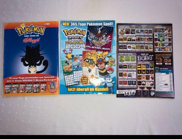 15xPokémon Hefte und 6xPoster in Mintraching