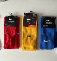 Nike Stutzen blau gelb rot Gr. L 42-46 UK 8-11 Niedersachsen - Horneburg Vorschau