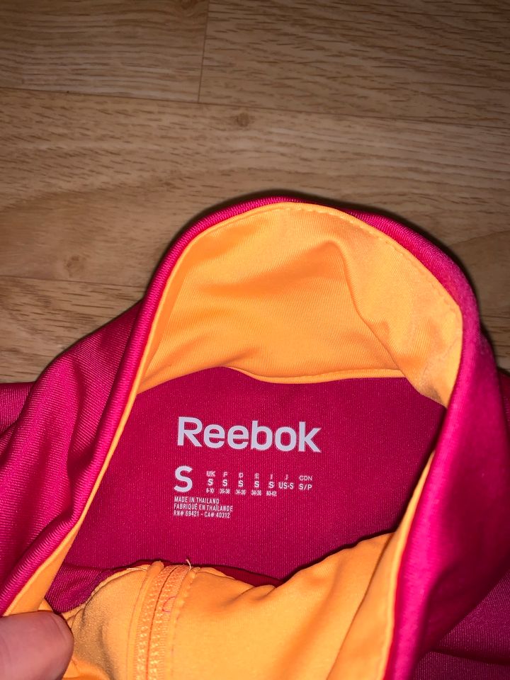 Reebok Sportjacke pink orange Größe S in Essen