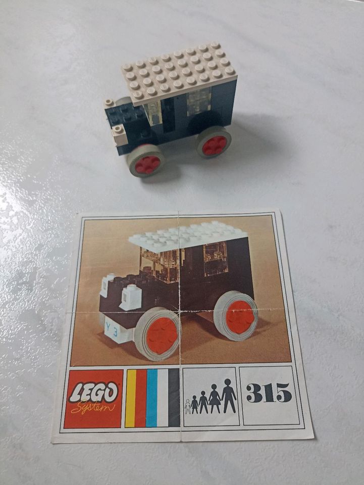 Lego Holzkiste mit Steinen und Anleitungen Flugzeug,Kran und mehr in Oelde