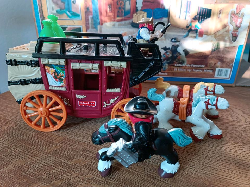 Fisher-Price Wild West Stadt + Kutsche + Rodeo Stier in Moringen