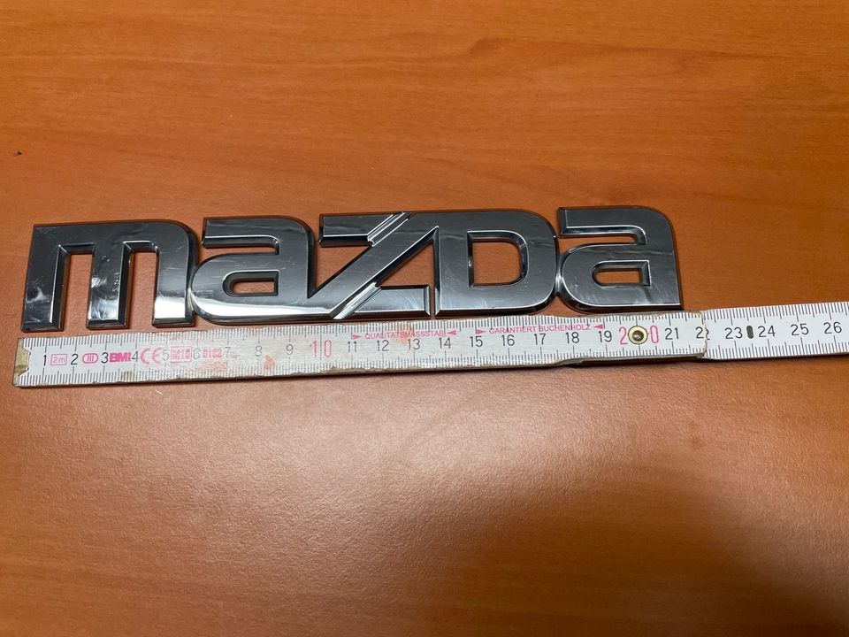 MAZDA Logo Schriftzug Emblem in Melle