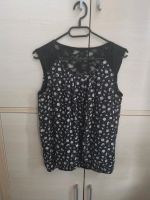 Schwarze Bluse kurzarm Tanktop Blumenmuster Gr 38 Clockhouse Sachsen-Anhalt - Bernburg (Saale) Vorschau