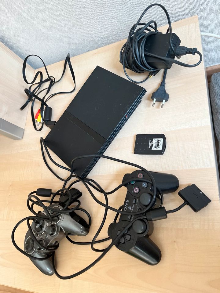 PlayStation 2 PS 2 mit verschiedenen Spielen Singstar EyeToy in Osnabrück