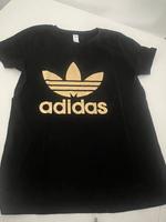 Adidas T-Shirt schwarz mit Gold Damen Größe M Hessen - Vellmar Vorschau