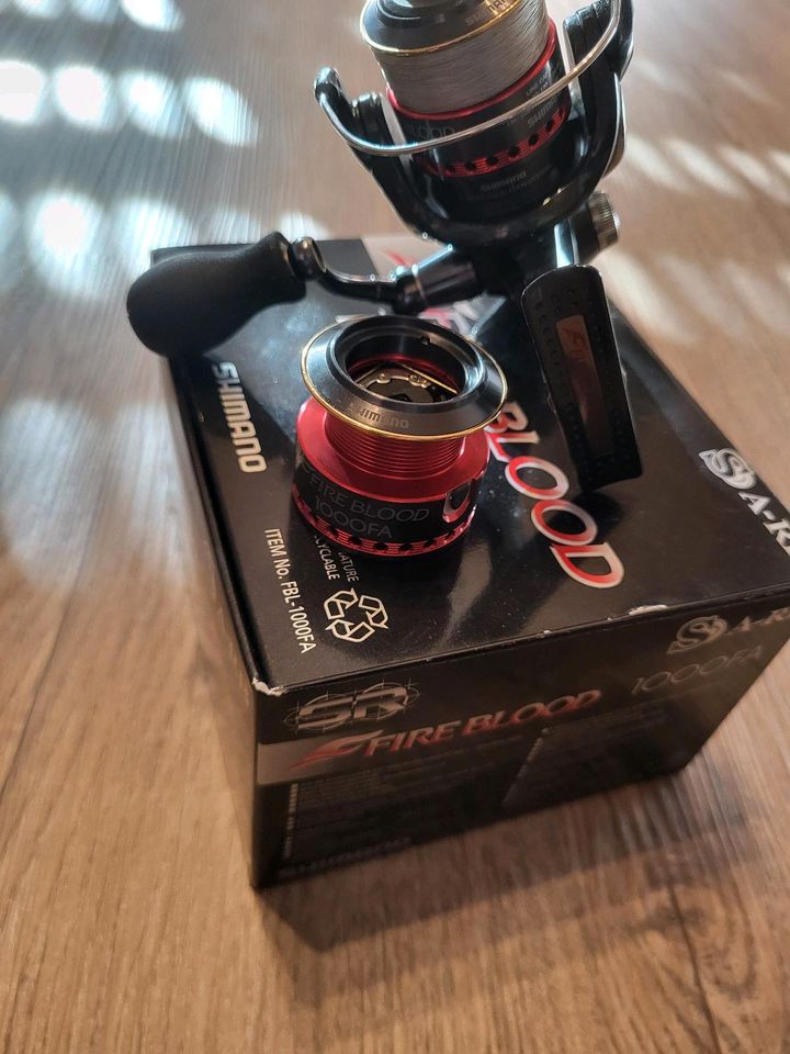 Shimano Fireblood 1000 FA + E Spule Angelrolle Spinnrolle in Vilsbiburg