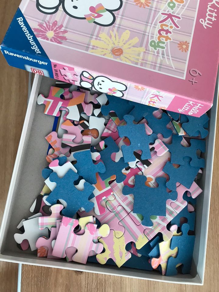 Set Hello Kitty 100 Puzzle und H&M Kleid Gr. 110/116 in Saarbrücken