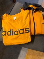 Eine Jacke (40), ein T-Shirt (38) orange beides von adidas Kr. München - Grünwald Vorschau