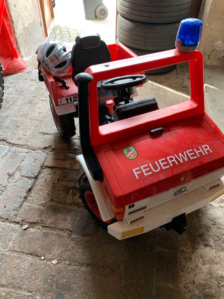 Rolly Toys Unimog Feuerwehr Luftbereifung + Zubehör in Ebersbach bei Großenhain