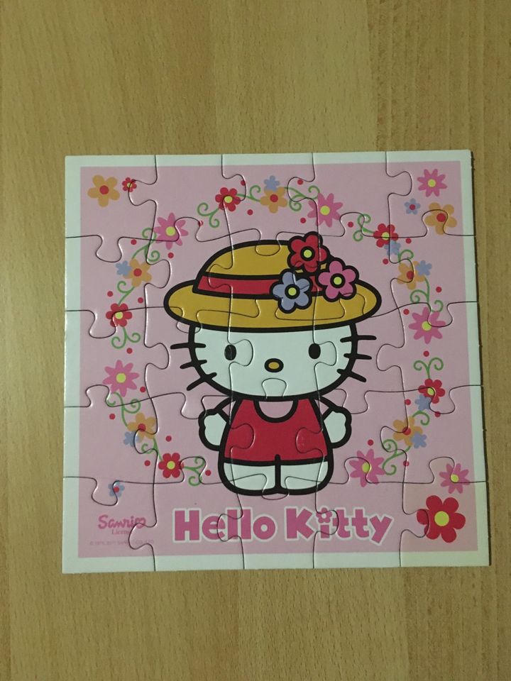 Vier Puzzles von Hello Kitty im Koffer in Osnabrück