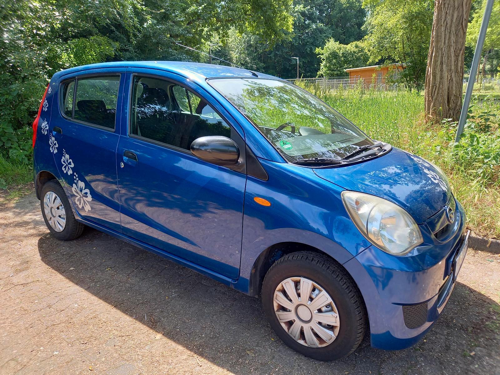 Abbildung des Autos Daihatsu Coure Cooline T…