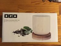 2 OGO Living Porzellantassen Enzo (250 ml) mit Holzuntersetzer Schleswig-Holstein - Bad Segeberg Vorschau