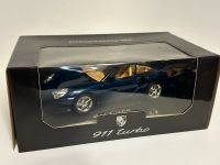 Bburago Porsche 911 turbo in Lapisblau mit Creme Leder (1:18) Hessen - Ginsheim-Gustavsburg Vorschau