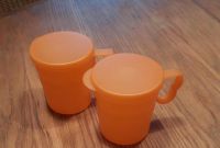 Tupperware Trinkbecher mit Deckel  orange Nordrhein-Westfalen - Langerwehe Vorschau