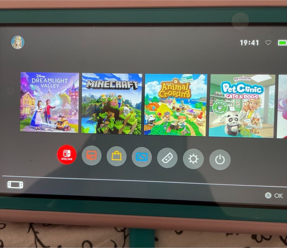 Nintendo Switch Light Türkis + Spiele und Zubehör in Senden
