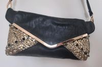 Schwarze Clutch mit Nieten in Gold und Silber Nordrhein-Westfalen - Paderborn Vorschau