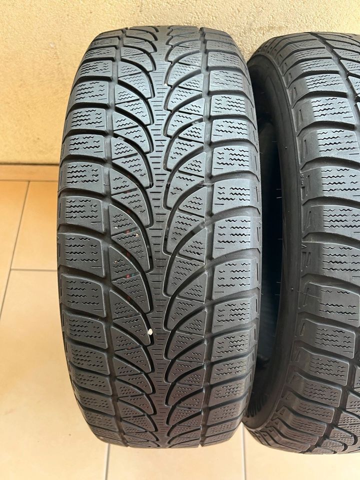 2x 215 60 R16 99H Winterreifen Bridgestone 5,5mm DOT:2016 in Meschede