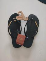 Havaianas schwarz mit Gold-Schrift Gr.37/38 Schleswig-Holstein - Oststeinbek Vorschau