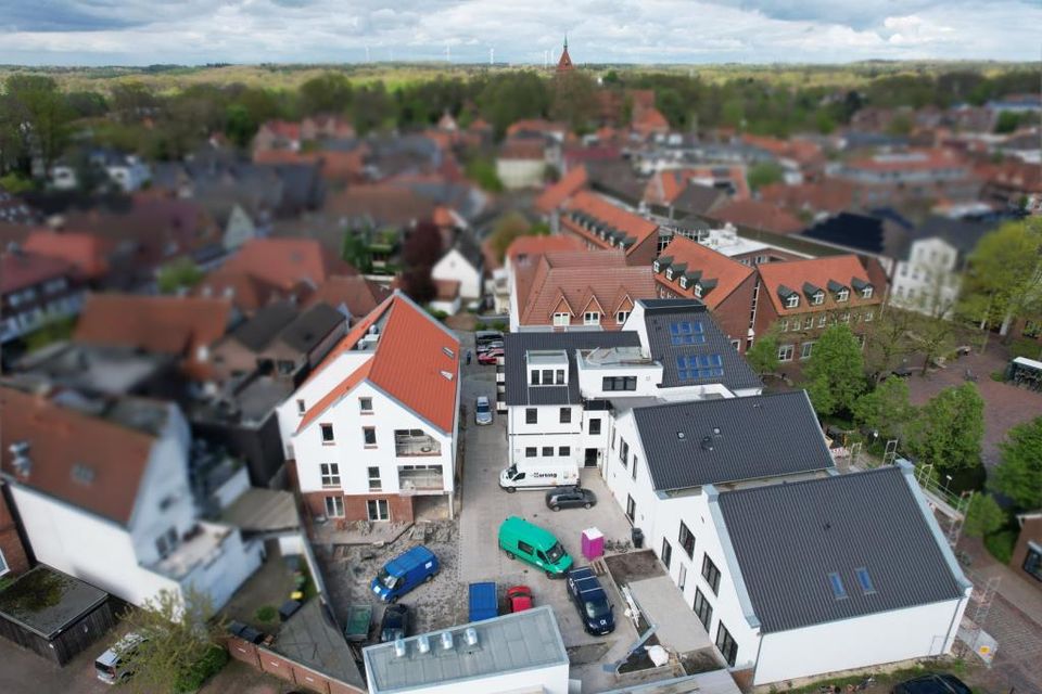 Dachgeschosswohnung - seniorengerechte Wohnung mit Blick Richtung  Kirche über neuer Zahnarztpraxis im Neu-/Umbau am Stellmacherplatz in zentraler Lage in Wildeshausen