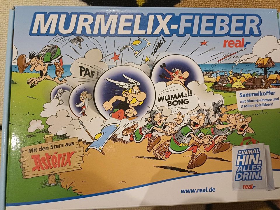 Real,-  Murmelfieber in der Asterix Edition mit Murmeln in Graben (Lechfeld)