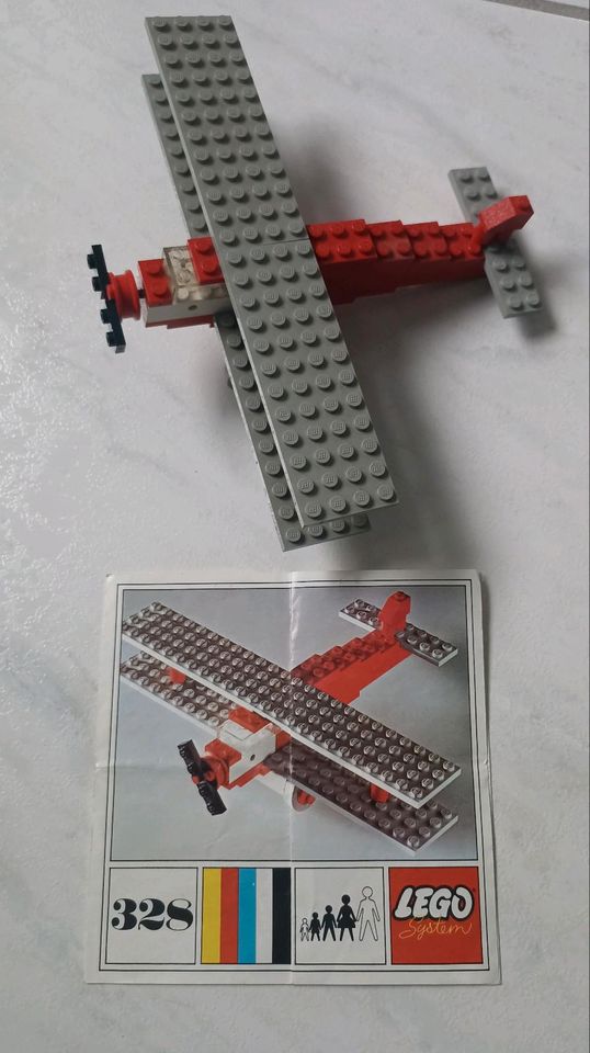 Lego Holzkiste mit Steinen und Anleitungen Flugzeug,Kran und mehr in Oelde