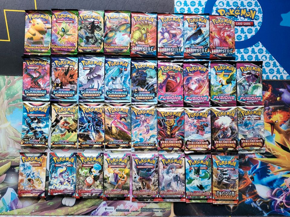 100 Pokemon Karten deutsch boosterfrisch + V ex Booster Holo Tin in Berlin