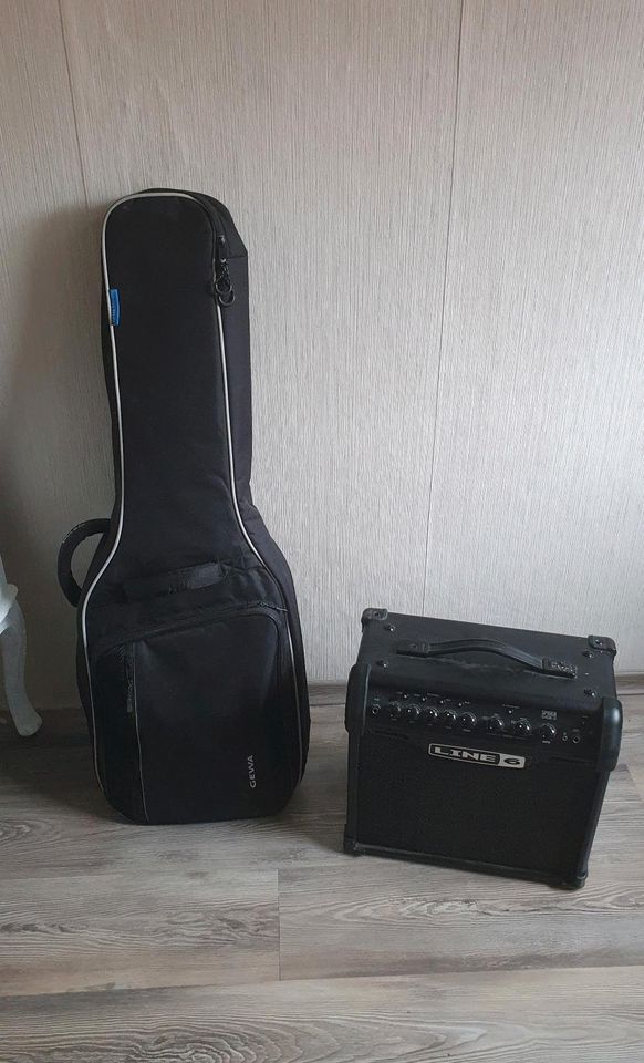 E-Gitarre in Schwarz + verstärker, stimmgerät, songbook und gurt in Herten
