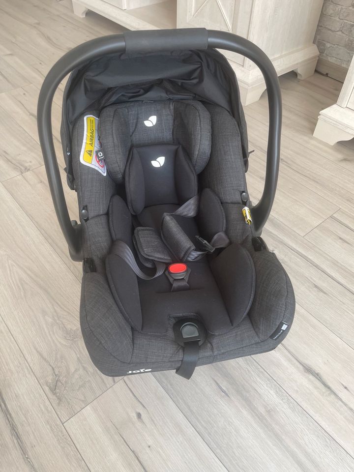 Joie Babyschale mit Newborneinsatz und Regenverdeck in Lünen