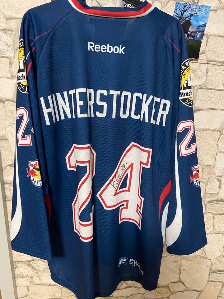 Trikot EHC Red Bull München Hinterstocker 24 Autogramm in Dachau