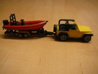 SIKU Spielzeug Jeep Wrangler mit Boot Motorboot Trailer Anhänger Nordrhein-Westfalen - Havixbeck Vorschau