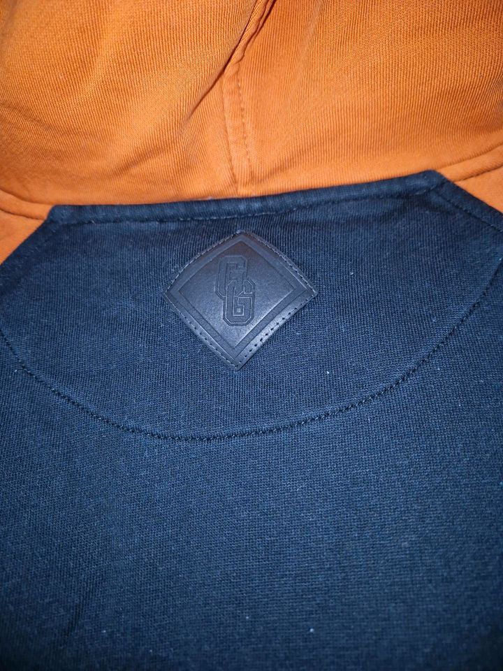 Verkaufe Grenzgänger Hoodie Orange/schwarz/weiß in Riesa