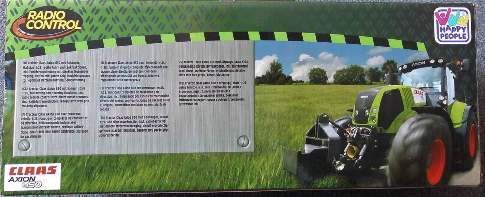 Happy People - Claas Axion 850 Traktor mit Anhänger + FB in Hambergen