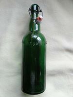 alte antike grüne Bügelflasche - Aufschrift: BRENNSPIRITUS Kreis Ostholstein - Bad Schwartau Vorschau
