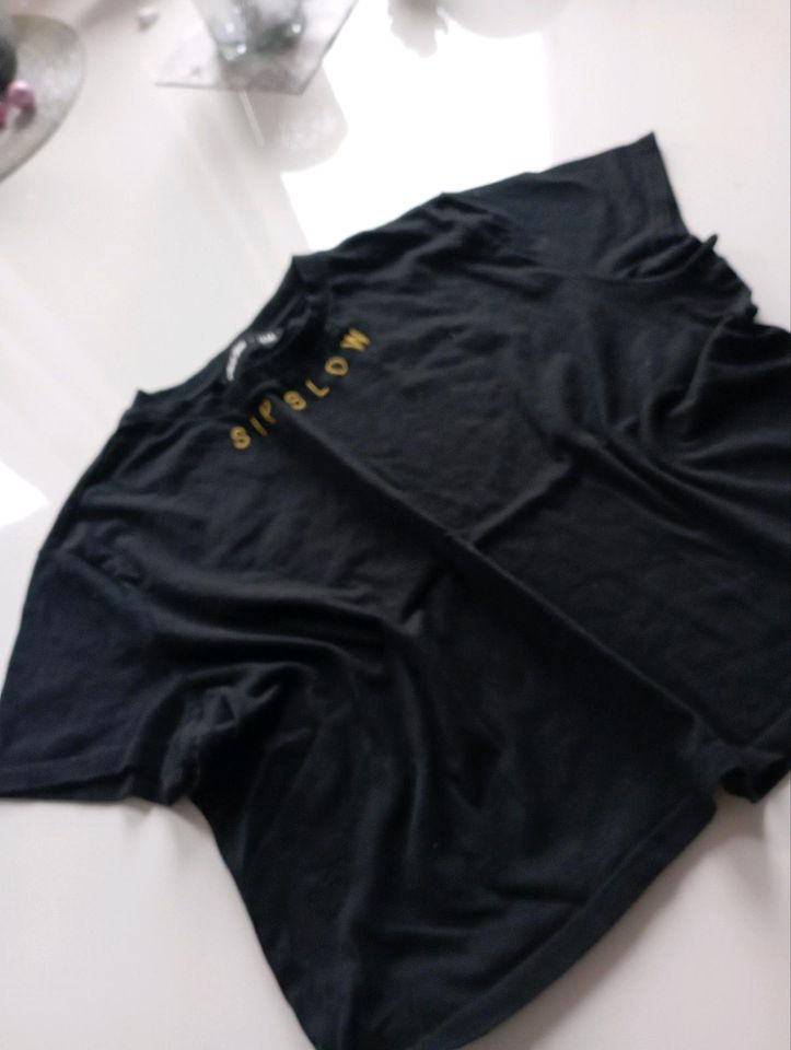 H&M Shirt schwarz Schrift  kastig geschnitten M 38 40 in Eutin